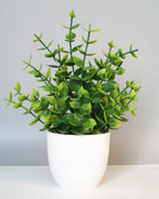Mini artificial potted plant, eucalyptus foliage in a matte white pot