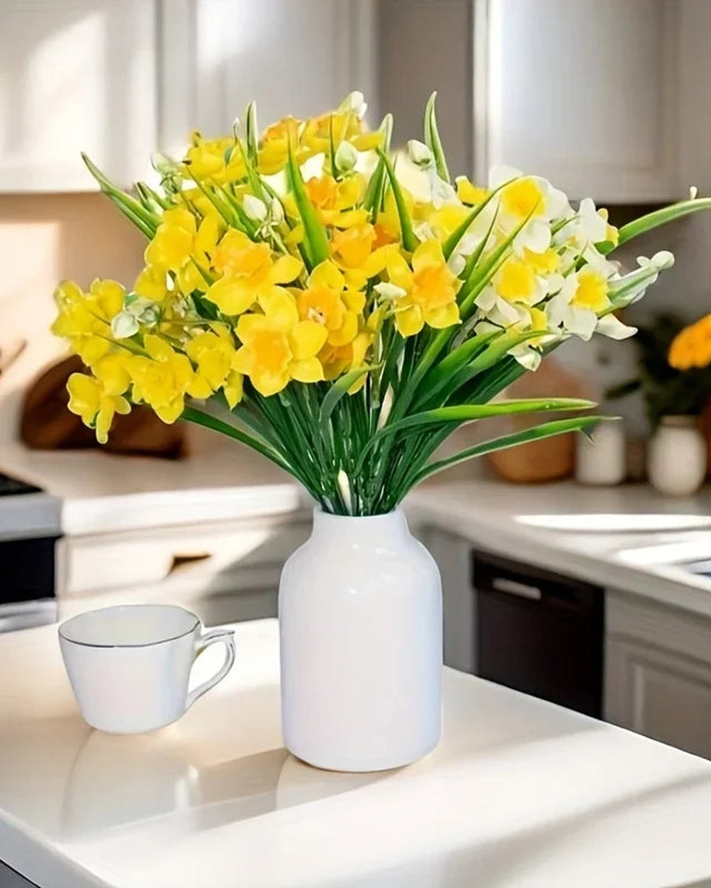 Daffodils arranged in a plain jug on a kitchen counter. Jug not included.