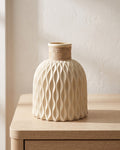 Beige rope neck vase, empty on a pale oak table