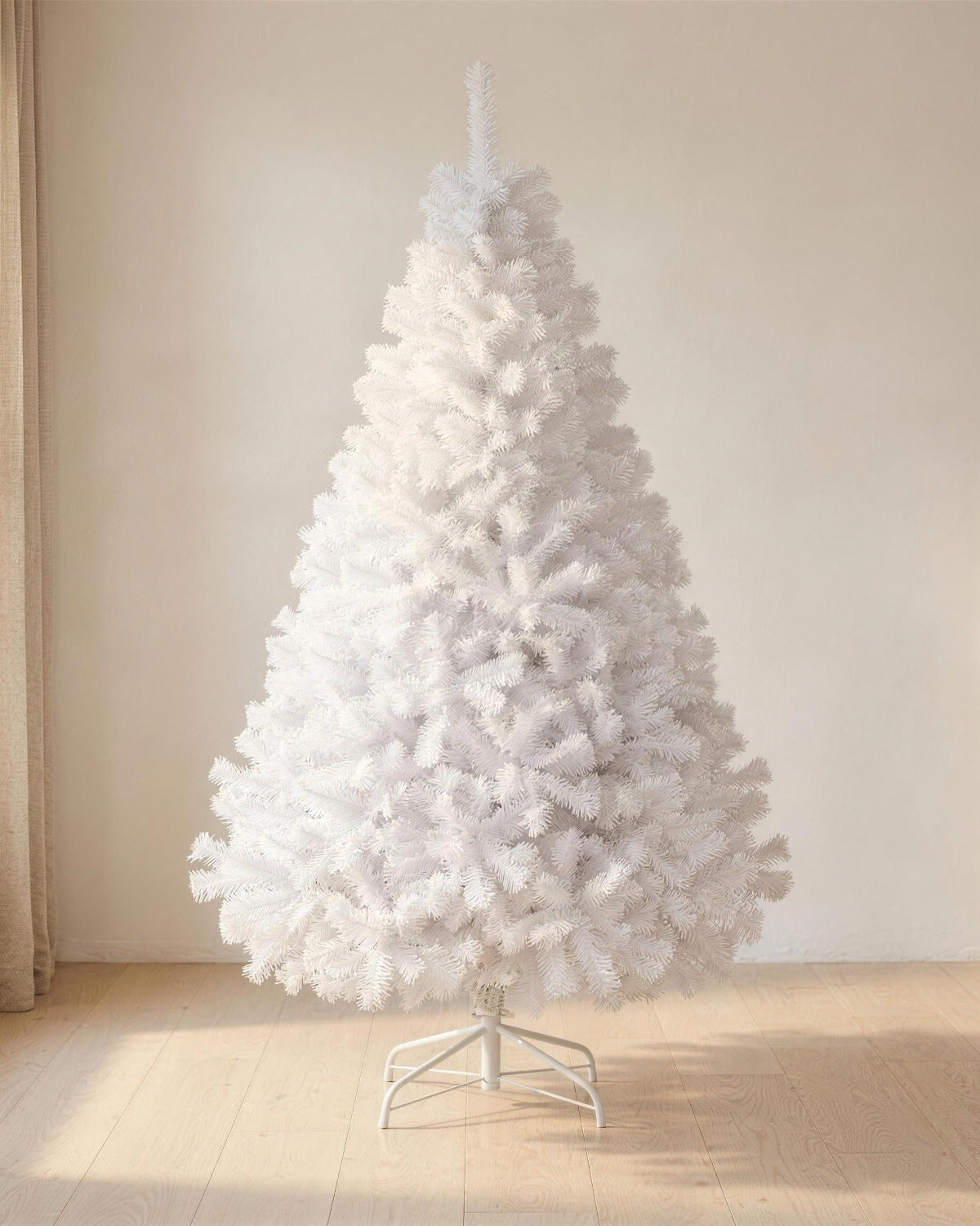 A white artificial Christmas tree, undecorated, on its stand in a bright room