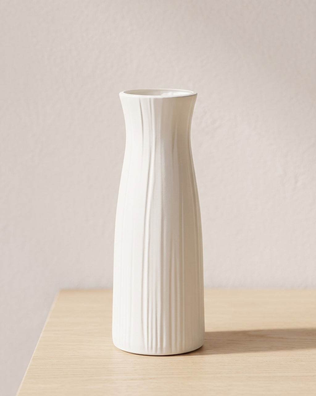 Fluted origami vase, 9.3 in, empty on a pale oak table