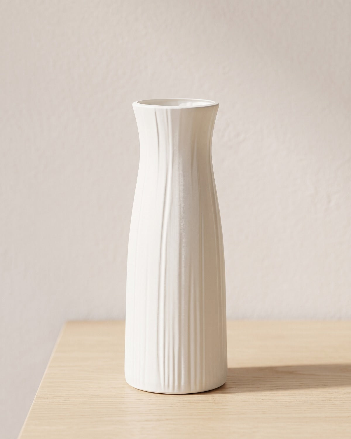 Fluted origami vase, 9.3 in, empty on a pale oak table