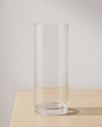 Clear acrylic cylinder vase, size S, empty on a pale oak table