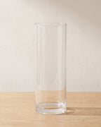 Clear acrylic cylinder vase, size M, empty on a pale oak table