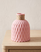 Pink rope neck vase, empty on a pale oak table