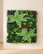 Variegated leaf and red berry artificial green wall panel fixed flat on an off-white plaster wall