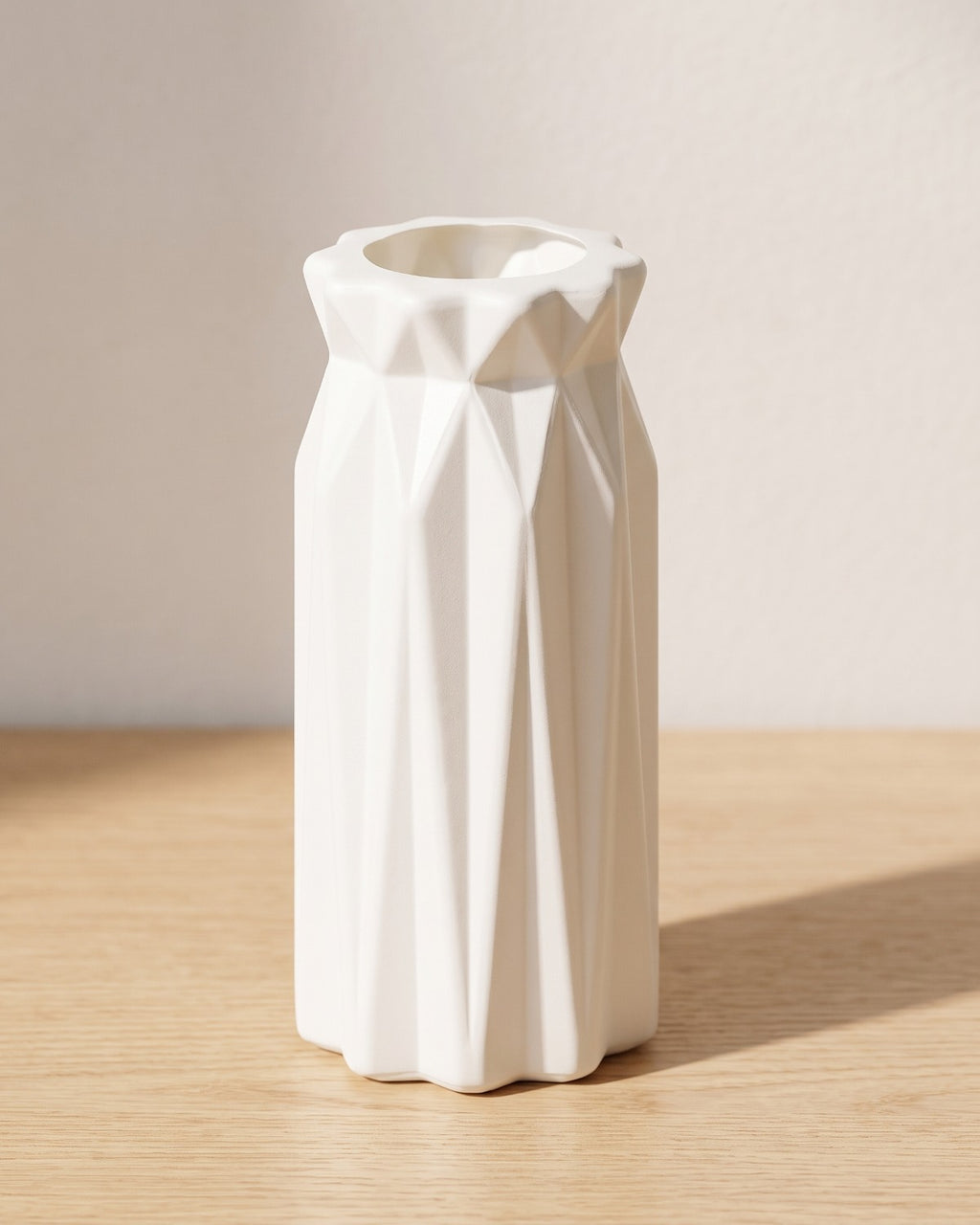 Folded origami vase, 7.1 in, empty on a pale oak table