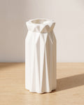 Folded origami vase, 7.1 in, empty on a pale oak table