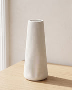 Fluted tapered vase, size L, empty on a pale oak table