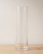Clear acrylic cylinder vase, size L, empty on a pale oak table