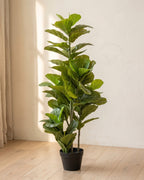 The tallest artificial fiddle leaf fig tree, a full column of leaves, in its black nursery pot on pale oak floorboards; planter not included