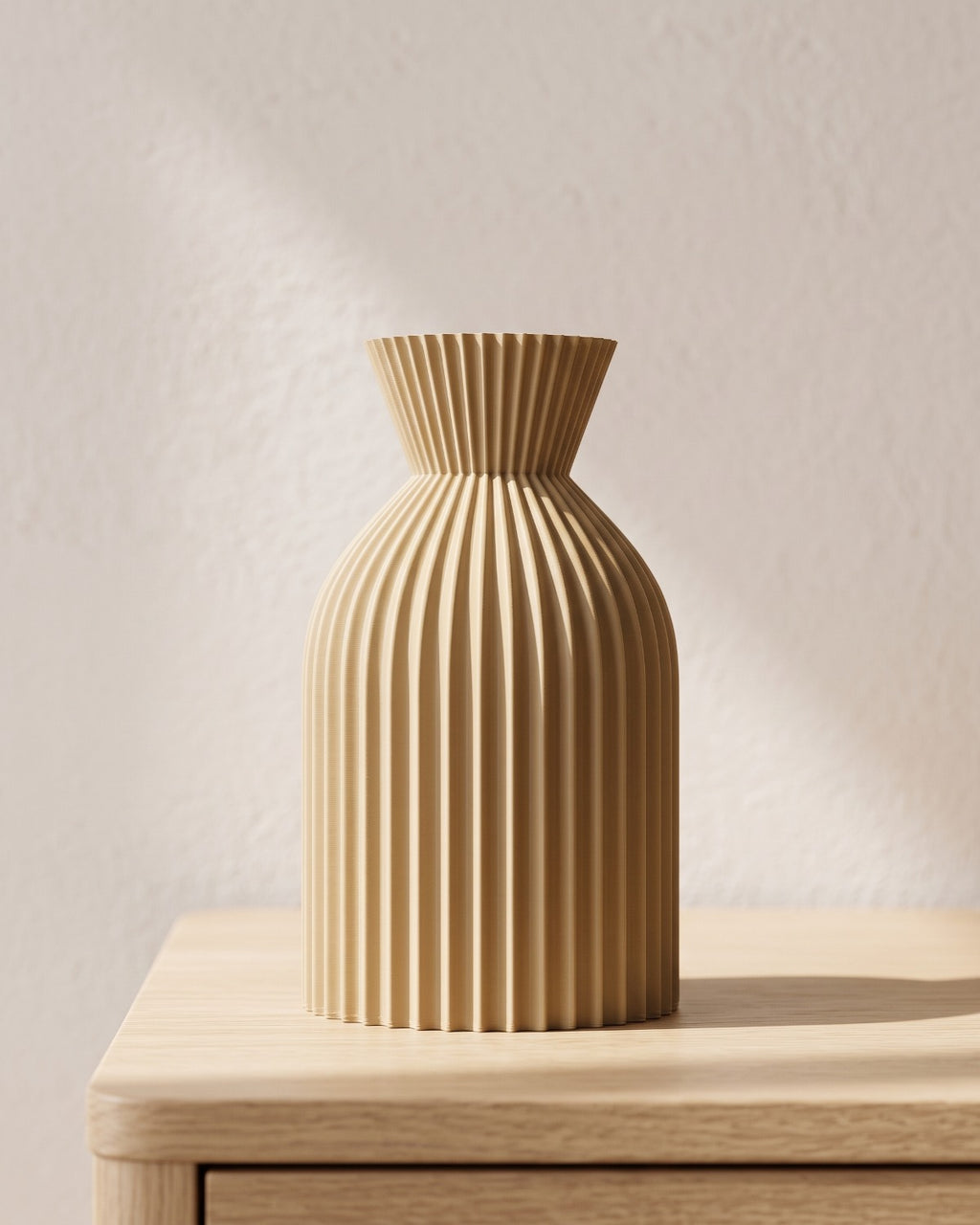Khaki ribbed bottle vase, small, empty on a pale oak table