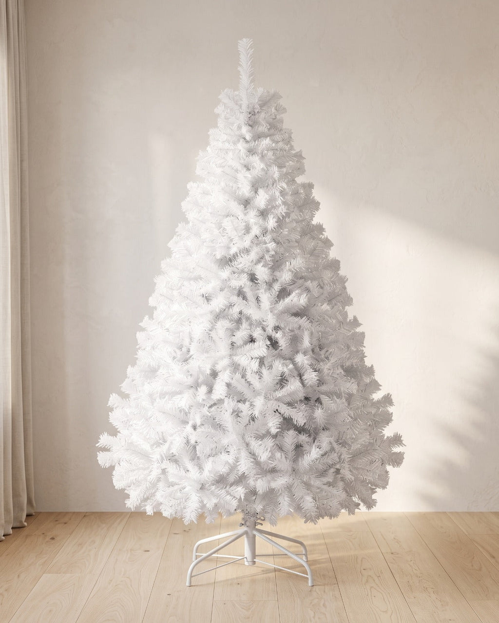 White artificial Christmas tree, undecorated, on its white folding stand
