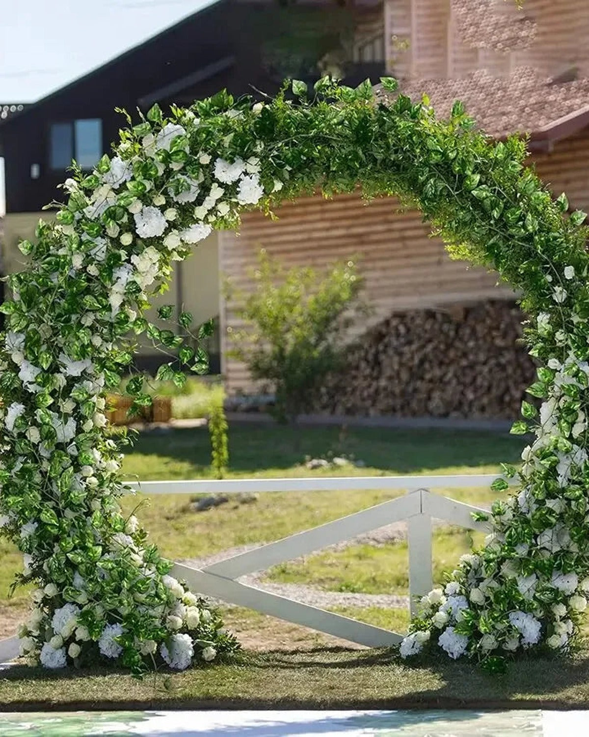 Artificial ivy garland trained over a garden archway