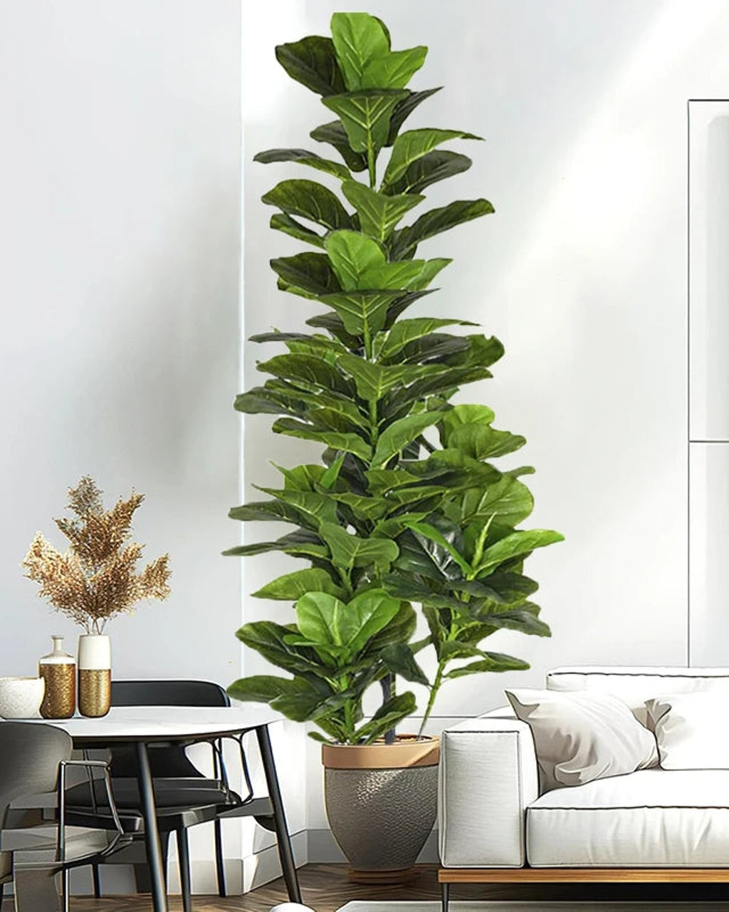 Artificial fiddle leaf fig tree in a gray pot behind a dining chair in a white room