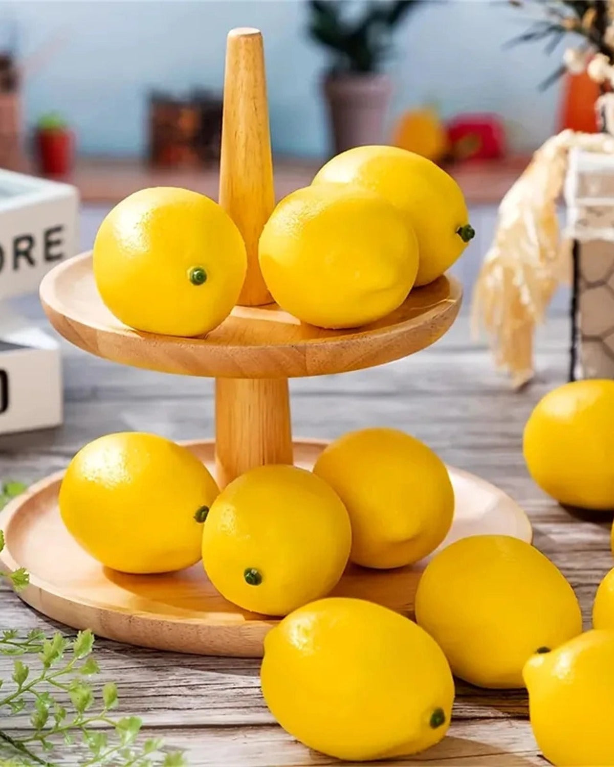 Artificial lemons on a two tier wooden stand