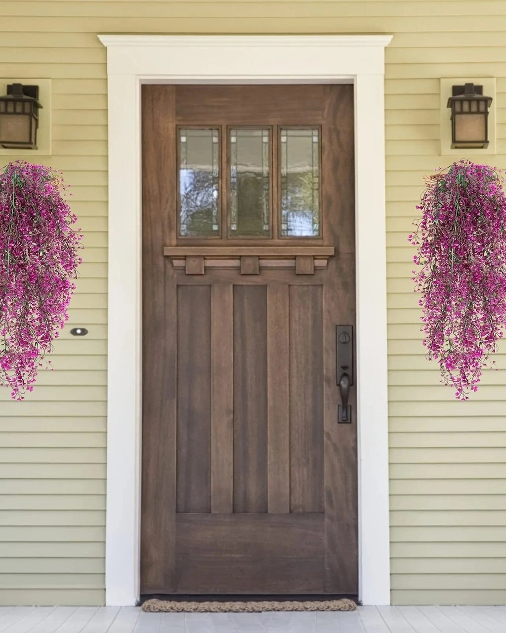 Magenta artificial wisteria sprays hung either side of a front door; each order is one spray