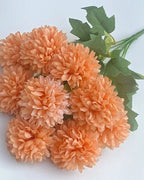 Peach artificial pompom chrysanthemums, the ball shaped blooms in close view