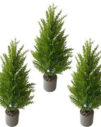 Three artificial pine trees in plain pots, seen together; pot not included