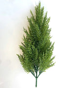A single artificial pine tree without a pot, showing its conical shape and the bare trunk below the needles