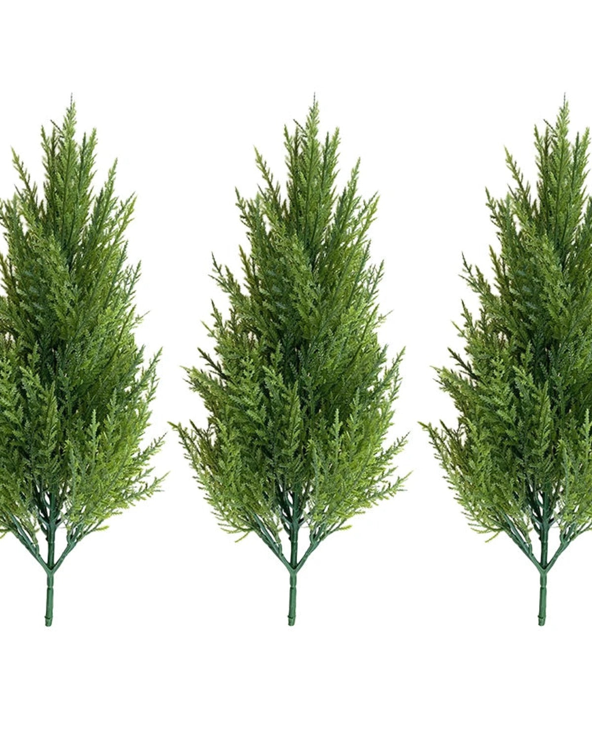 Three artificial pine trees without pots, side by side