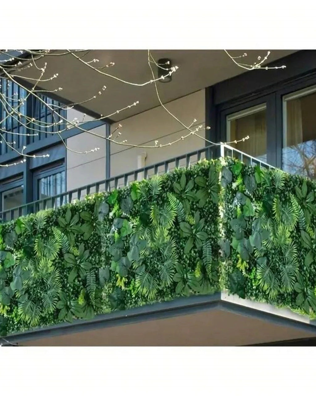 Artificial green wall panels cable tied along a balcony balustrade; each order is one panel