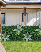 Artificial green wall panels along a garden fence beside a lawn; each order is one panel