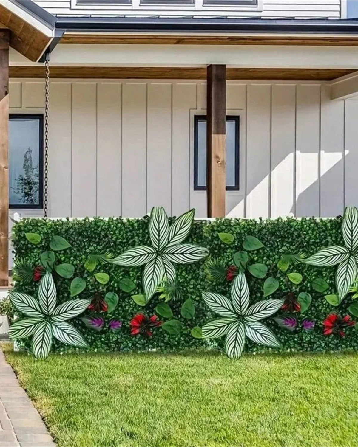 Artificial green wall panels along a garden fence beside a lawn; each order is one panel