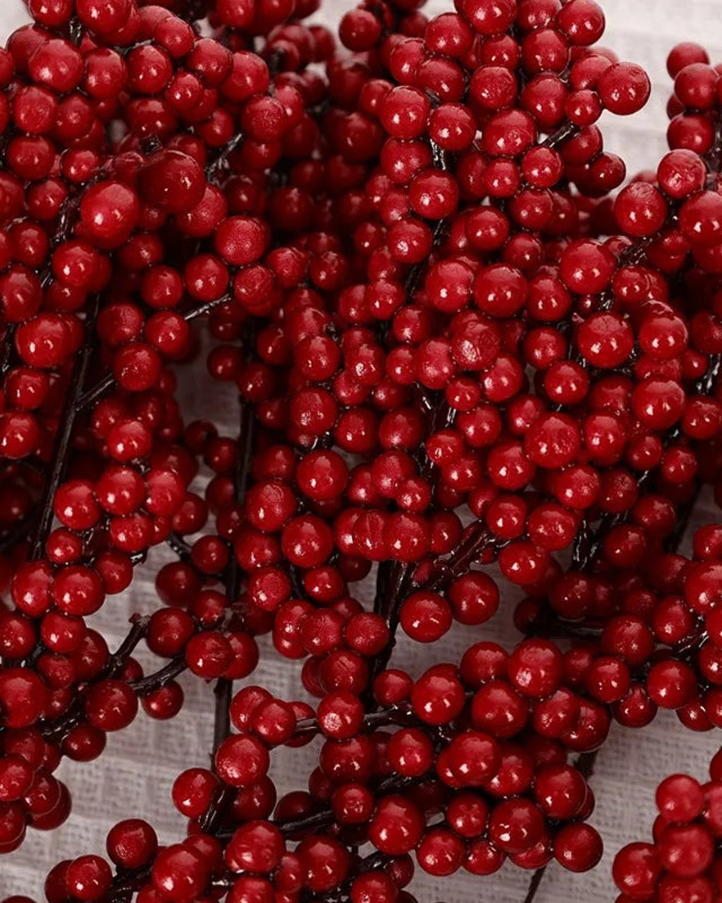 The clustered round berries of the artificial branch in close view