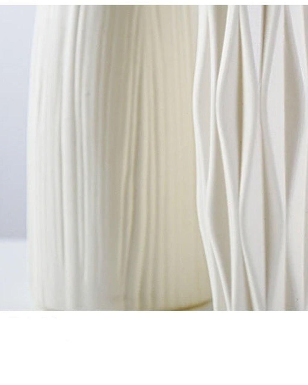A close look at the molded surface of the white origami vase