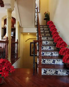 Red poinsettia bouquets lining a staircase, one to a step; several bouquets shown