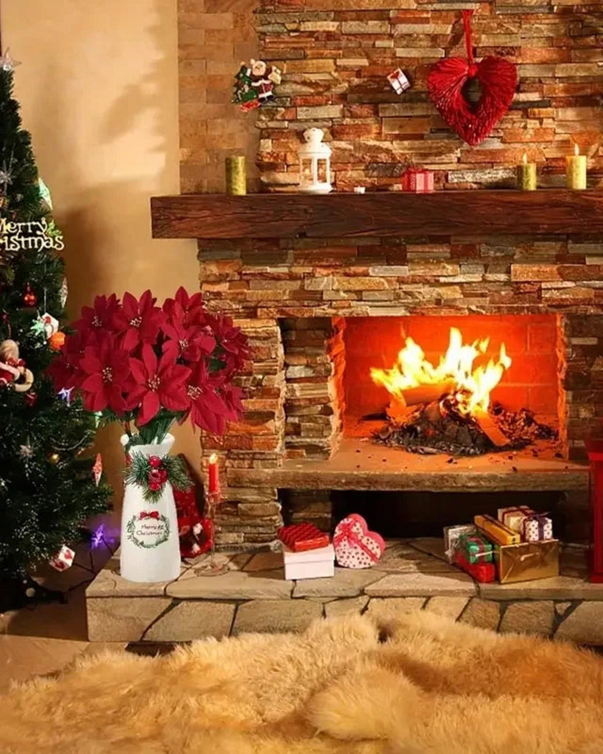 A red poinsettia bouquet in a white jug beside a stone fireplace; jug not included