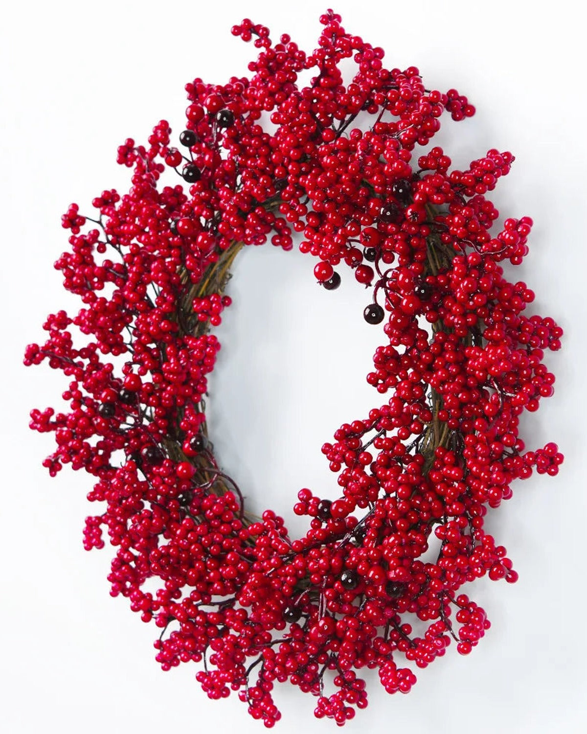 The red berry wreath from the side, showing its depth