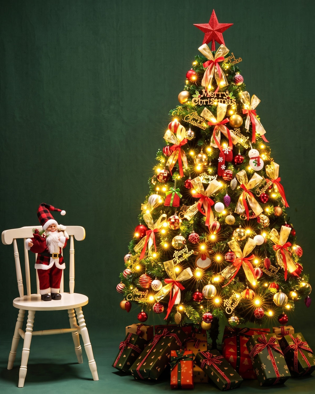 The spruce tree dressed with warm lights, gold ribbon and baubles beside a white chair; lights, ornaments, gifts and the Santa figure are not included