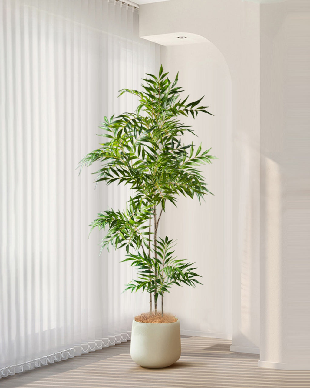 The bamboo branch in a white pot in front of vertical blinds (pot not included)