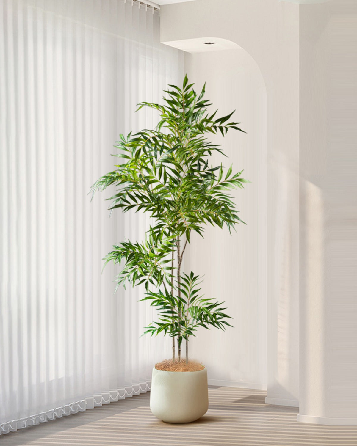 The bamboo branch in a white pot in front of vertical blinds (pot not included)