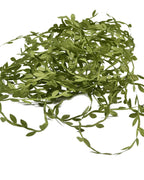 The leaf trim unwound into a loose heap, single strands running clear of it