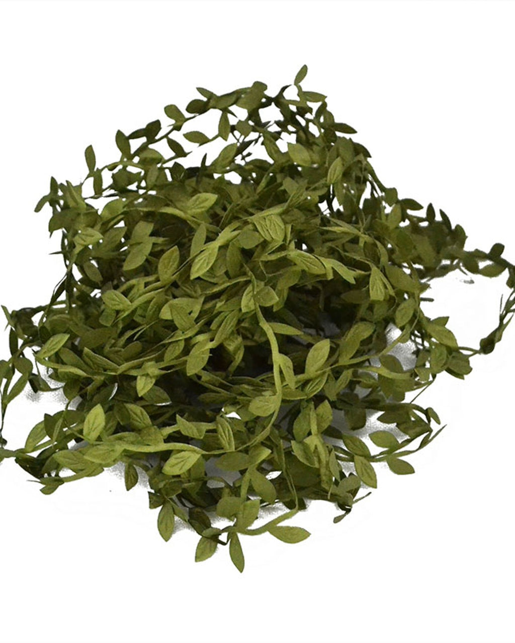 The leaf trim gathered into a dense pile, showing how much is on one coil