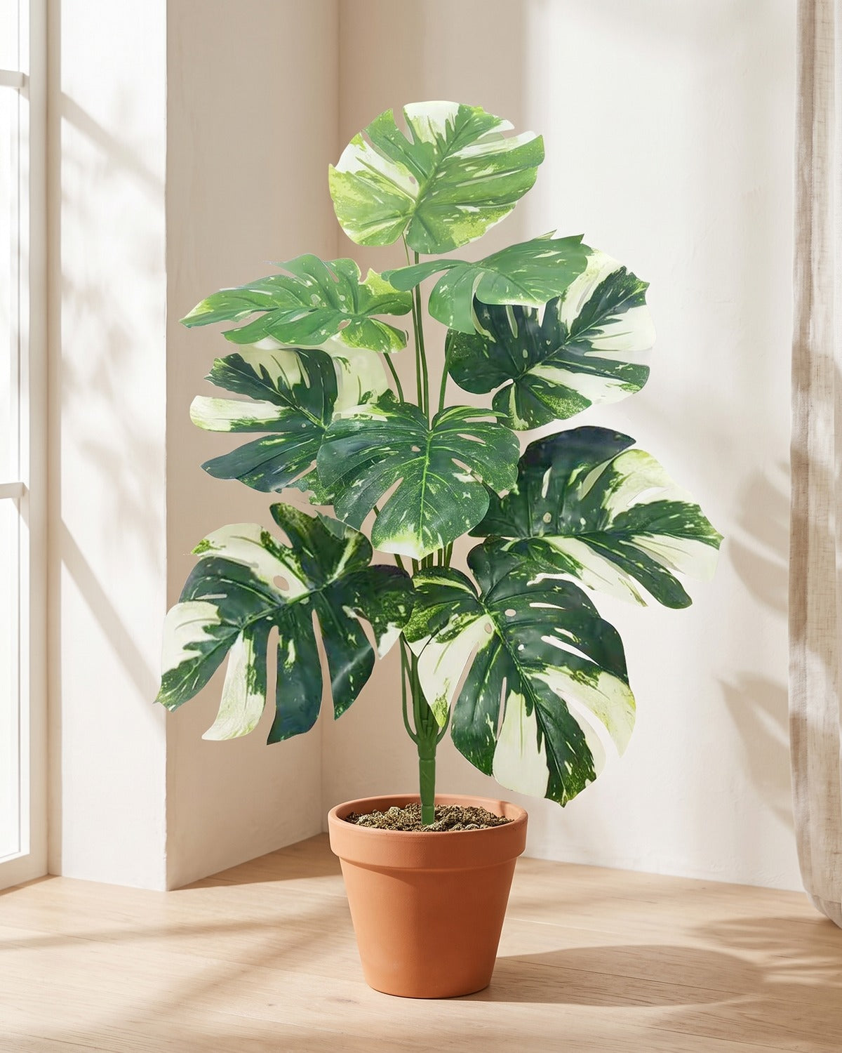 Variegated split leaf artificial leaf bush, 29.5 in with nine leaves, in a plain terracotta pot on pale oak floorboards; pot not included
