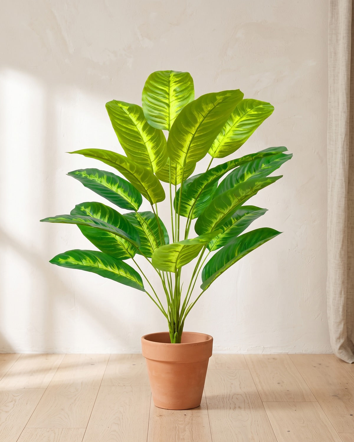 Variegated leaf artificial banana leaf plant, 31.9 in with eighteen leaves, in a plain terracotta pot on pale oak floorboards; pot not included