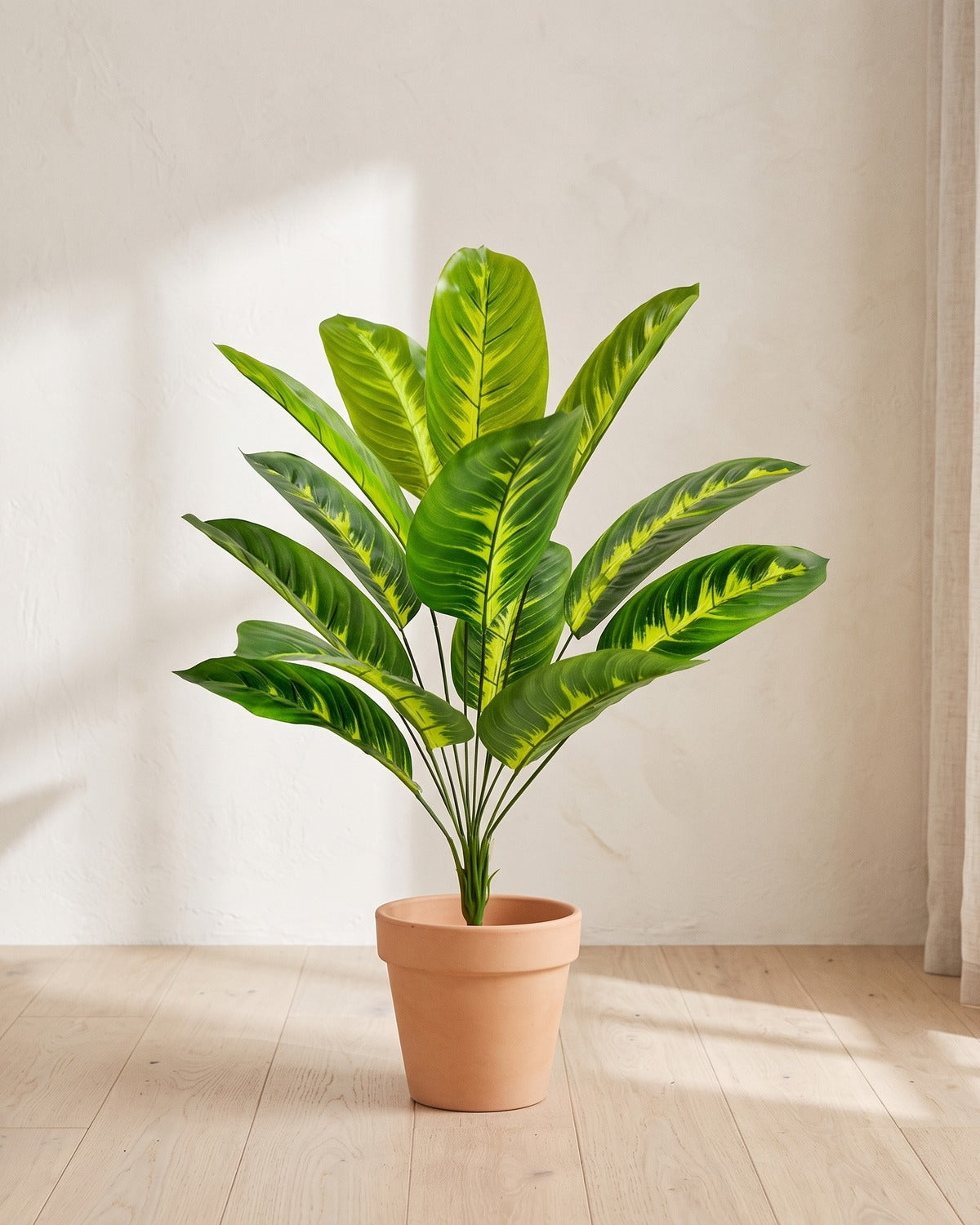 Variegated leaf artificial banana leaf plant, 26.6 in with twelve leaves, in a plain terracotta pot on pale oak floorboards; pot not included