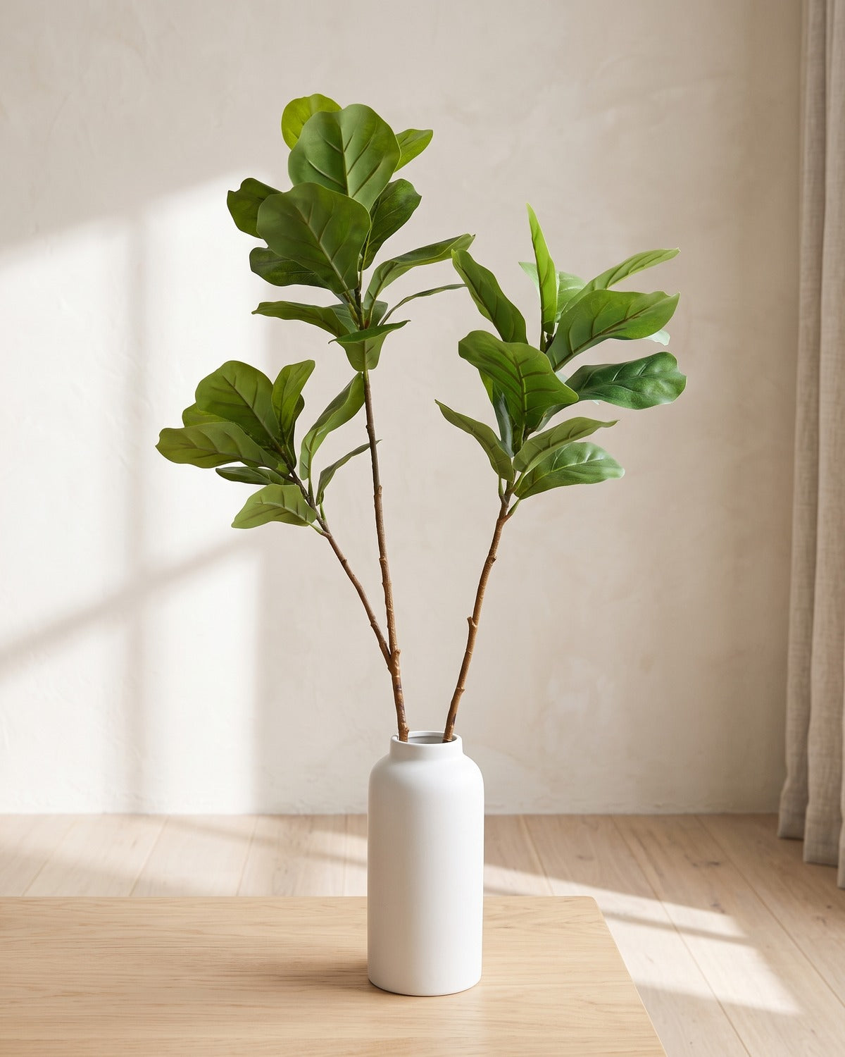 Fiddle leaf artificial tree branch, set of 2, 41.3 in, standing in a plain white vase on a pale oak table; no vase is included