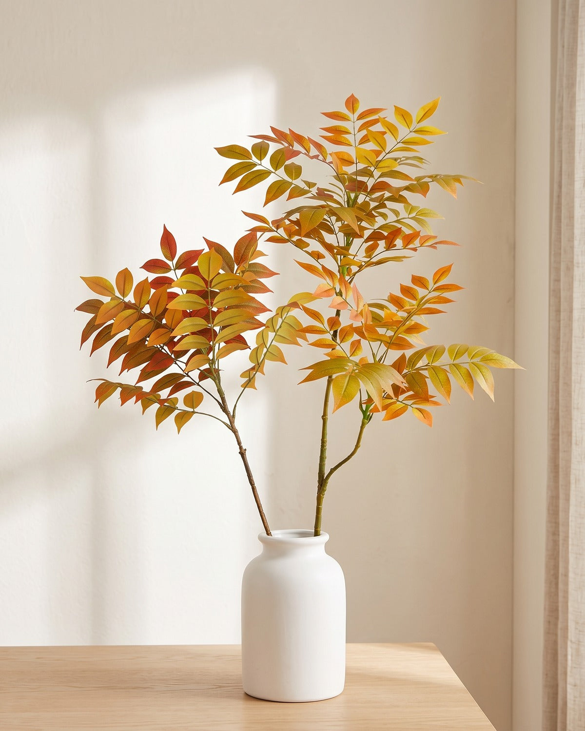 Autumn leaf artificial tree branch, set of 2, 43.3 in, standing in a plain white vase on a pale oak table; no vase is included